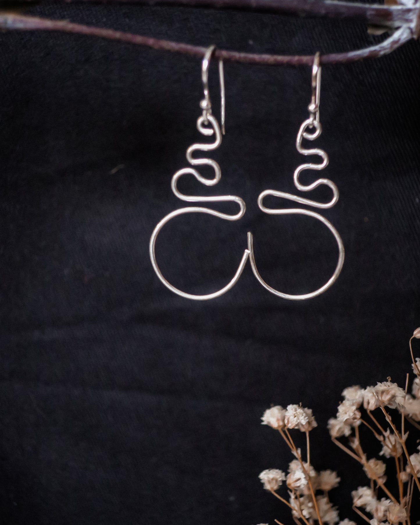 Earthen May Delicate wire swirl earrings. Funky, handmade sterling silver jewellery.